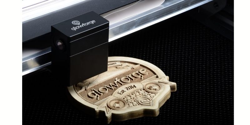 A picture of the Glowforge engraving wood