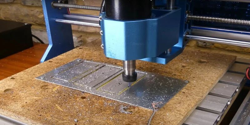 A CNC machine cutting dimensions specified from the original design file