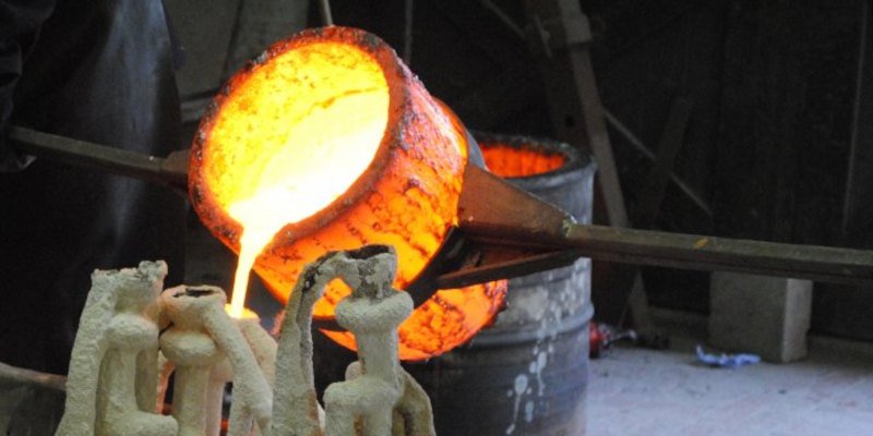 Molten metal poured into a wax and plaster cast