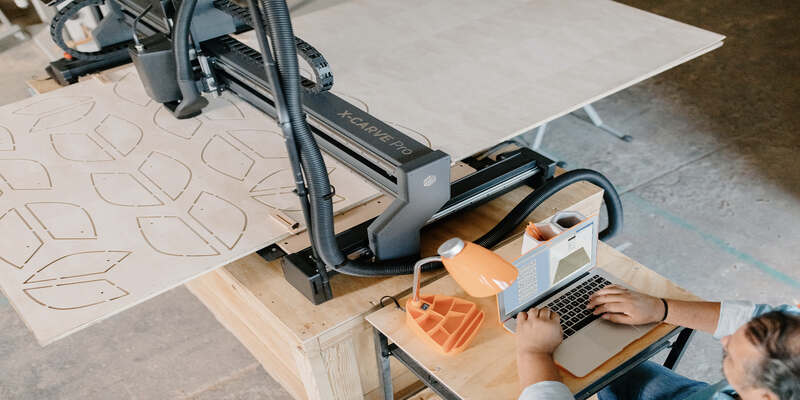 The X Carve Pro cutting wood