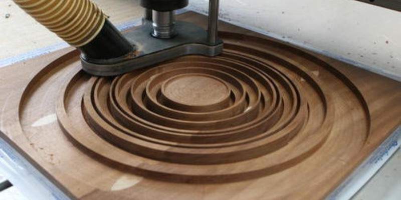 A CNC router carving wood
