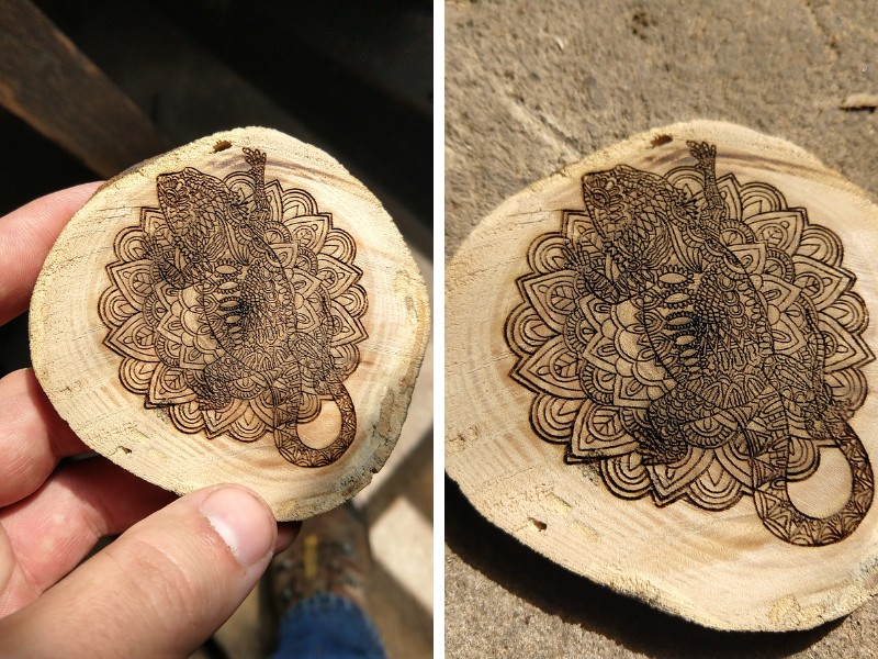 Precise engraving of a bearded dragon on a mandala for a coaster project.