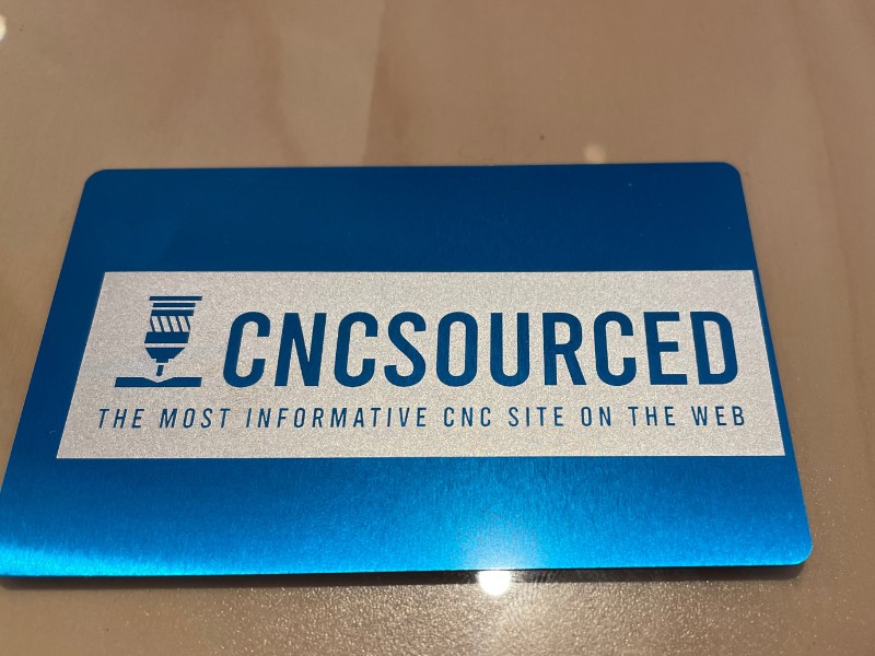 Laser engraved metal business card with CNCSourced logo 